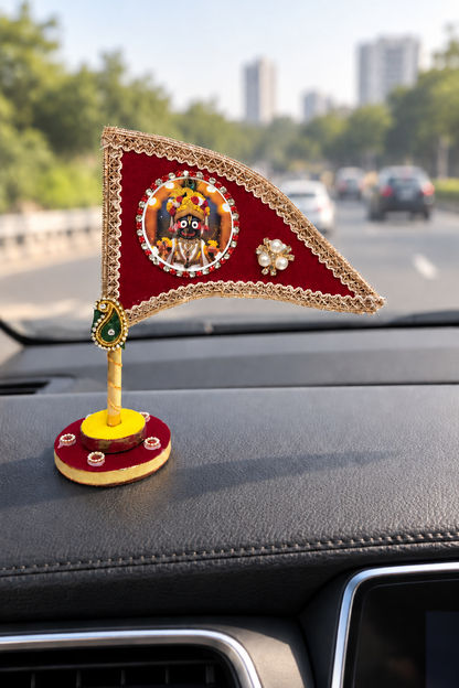 Jagannath Ji maroon nishan displayed on car dashboard