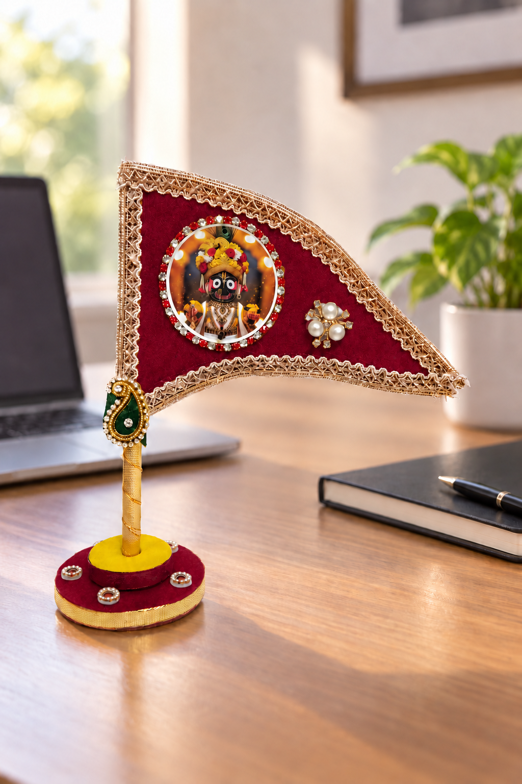 Jagannath Ji maroon decorative nishan displayed on office desk