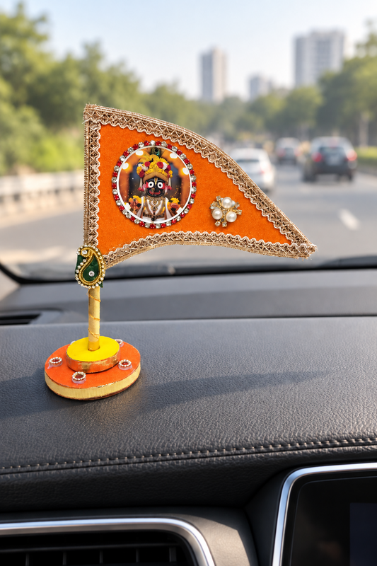 Jagannath Ji orange nishan displayed on car dashboard