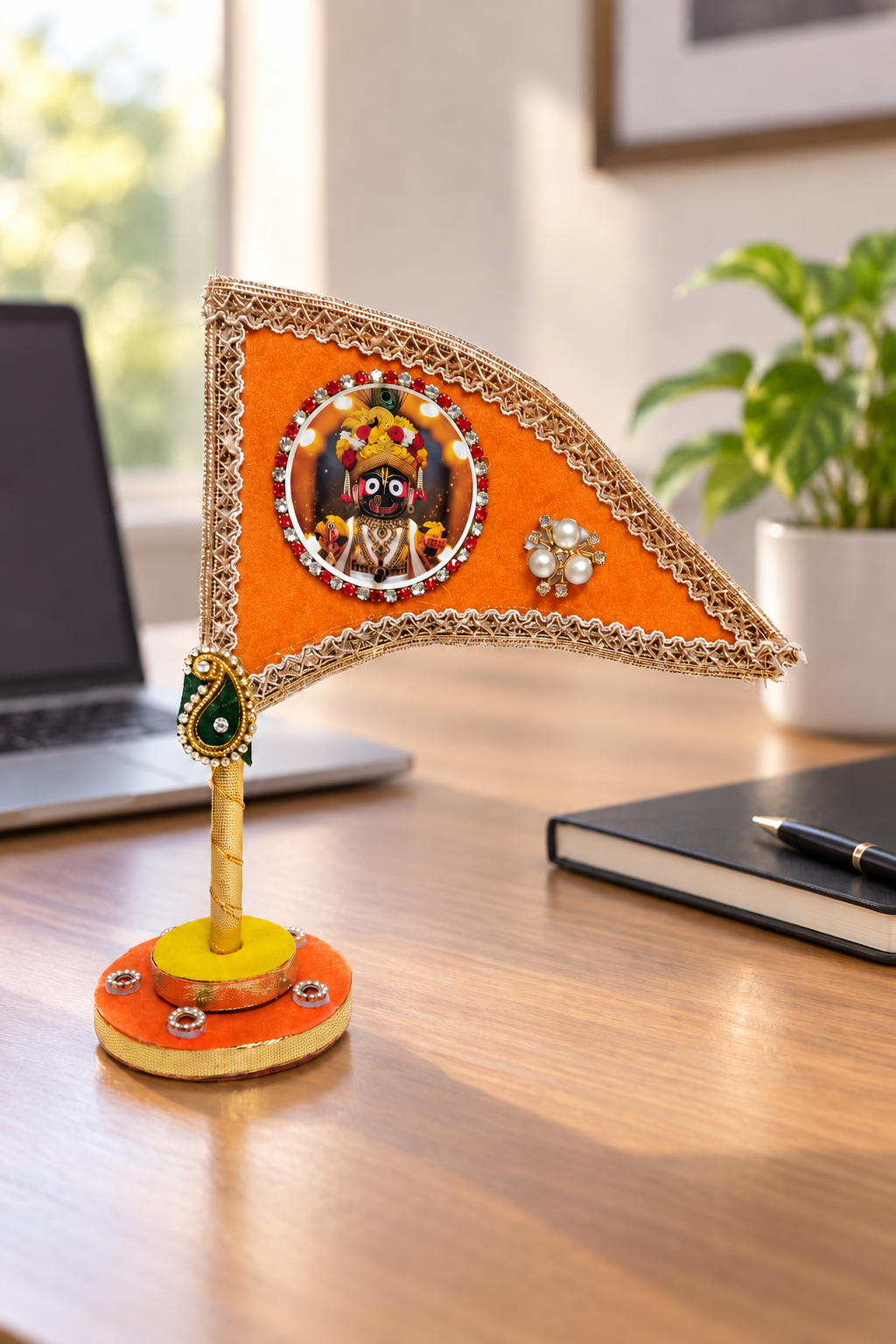 Jagannath Ji orange decorative nishan displayed on office desk