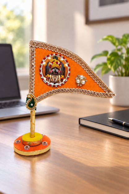 Jagannath Ji orange decorative nishan displayed on office desk