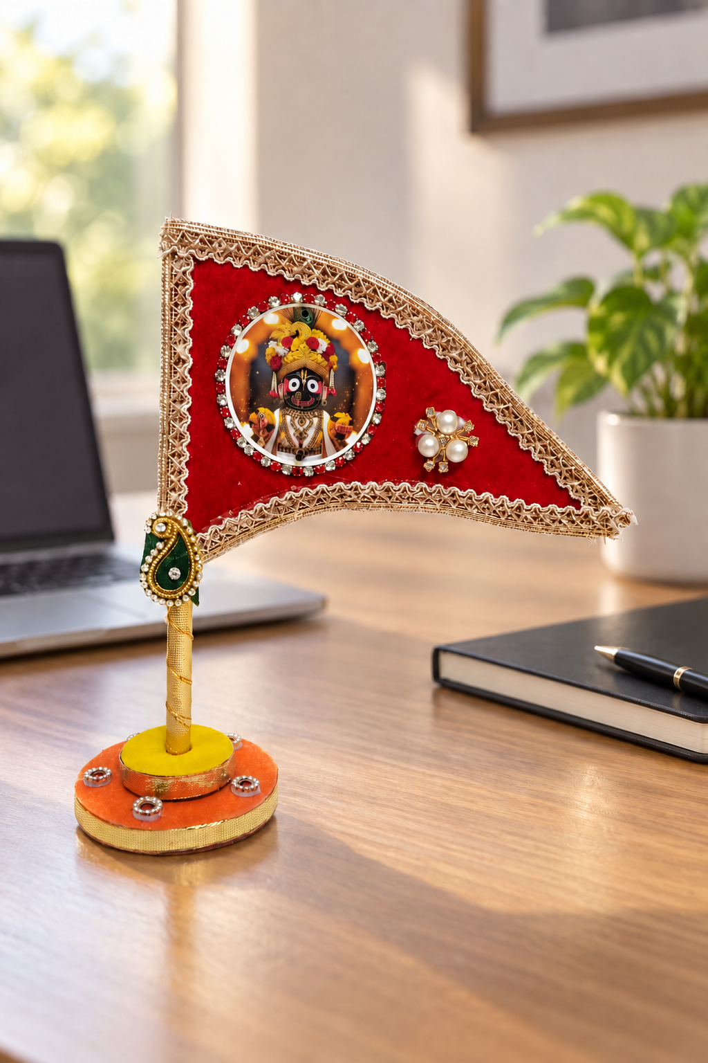 Jagannath Ji red decorative nishan displayed on office desk