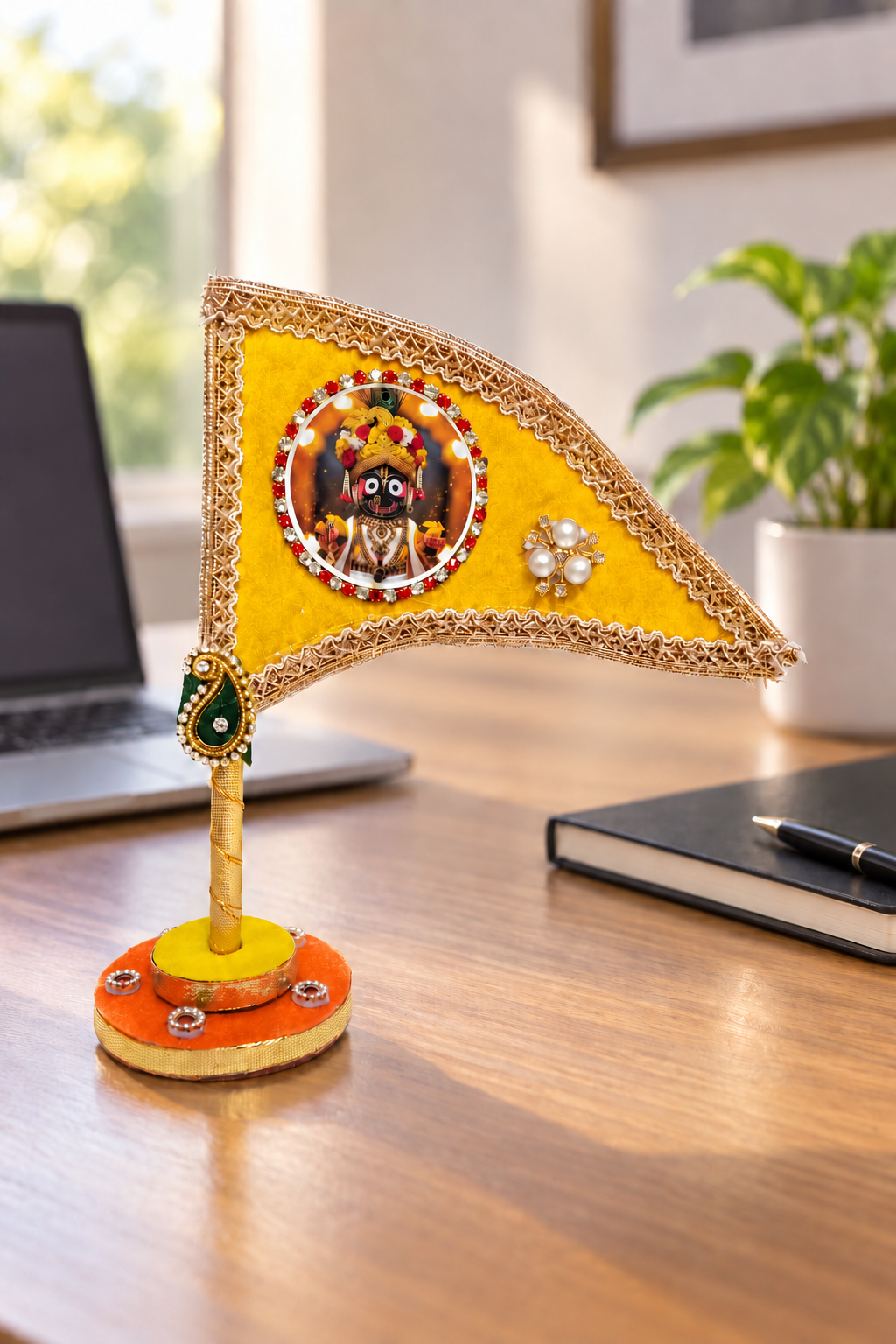 Jagannath Ji yellow decorative nishan displayed on office desk